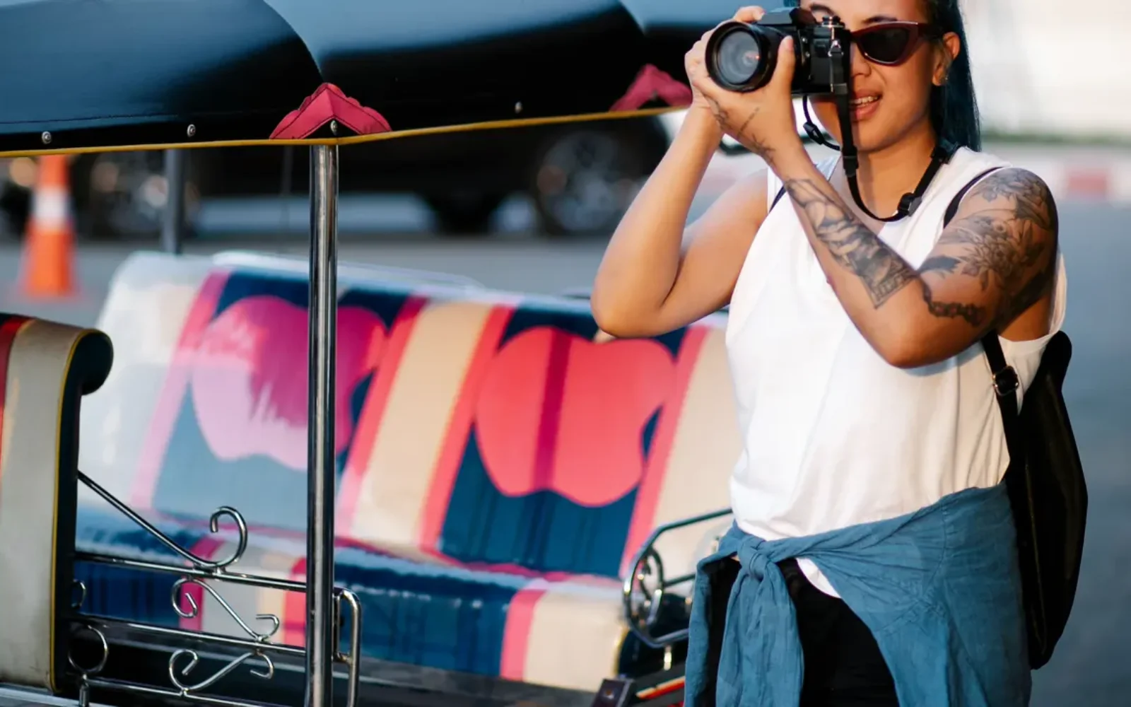 A traveler exploring a city with a camera