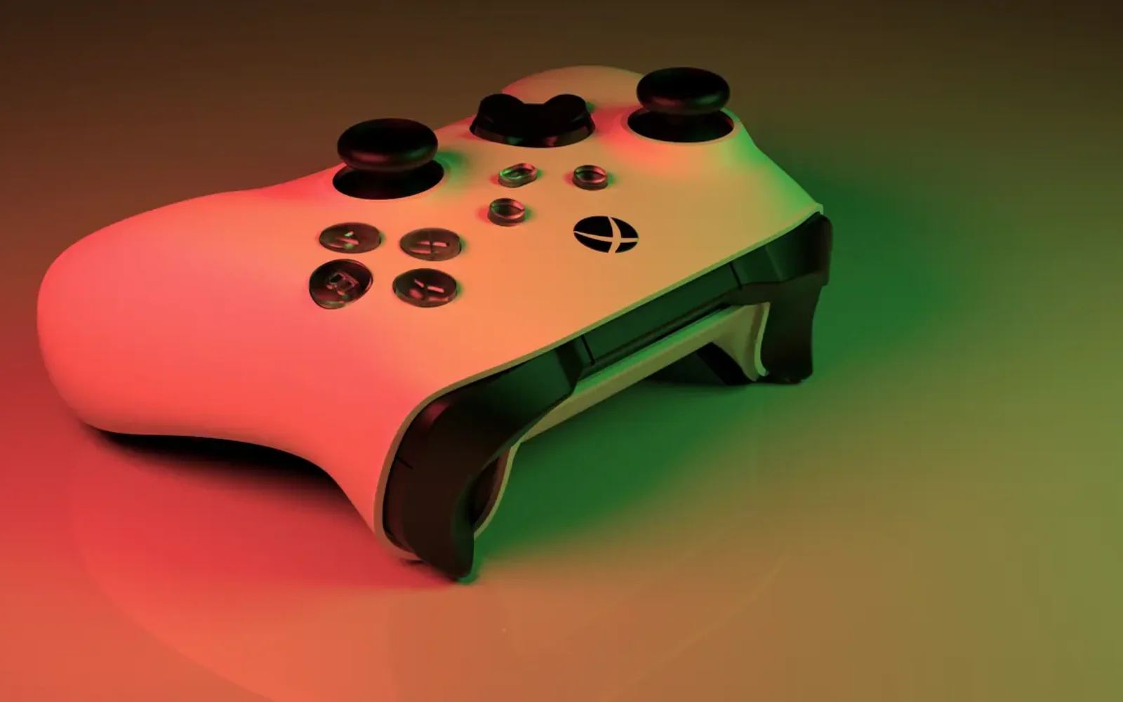 A game controller under colorful neon lights