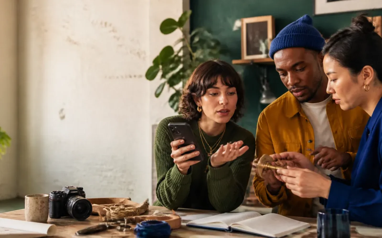 Friends using a phone camera and voice assistant to solve a hands-on problem