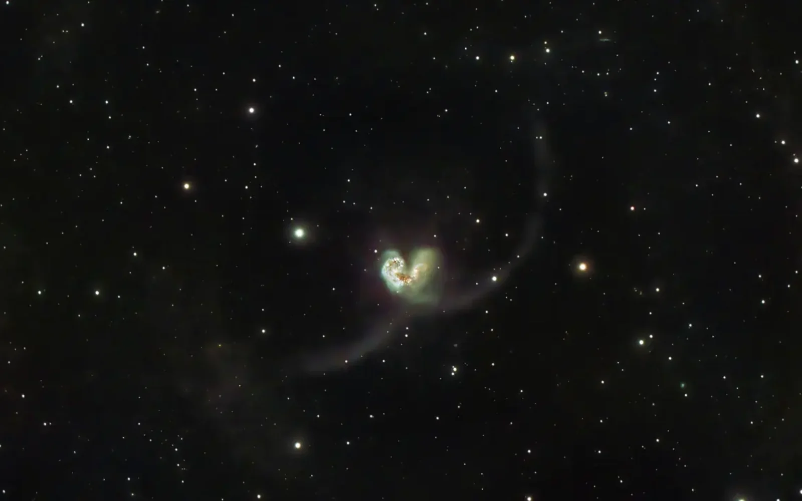 A distant galaxy and star field
