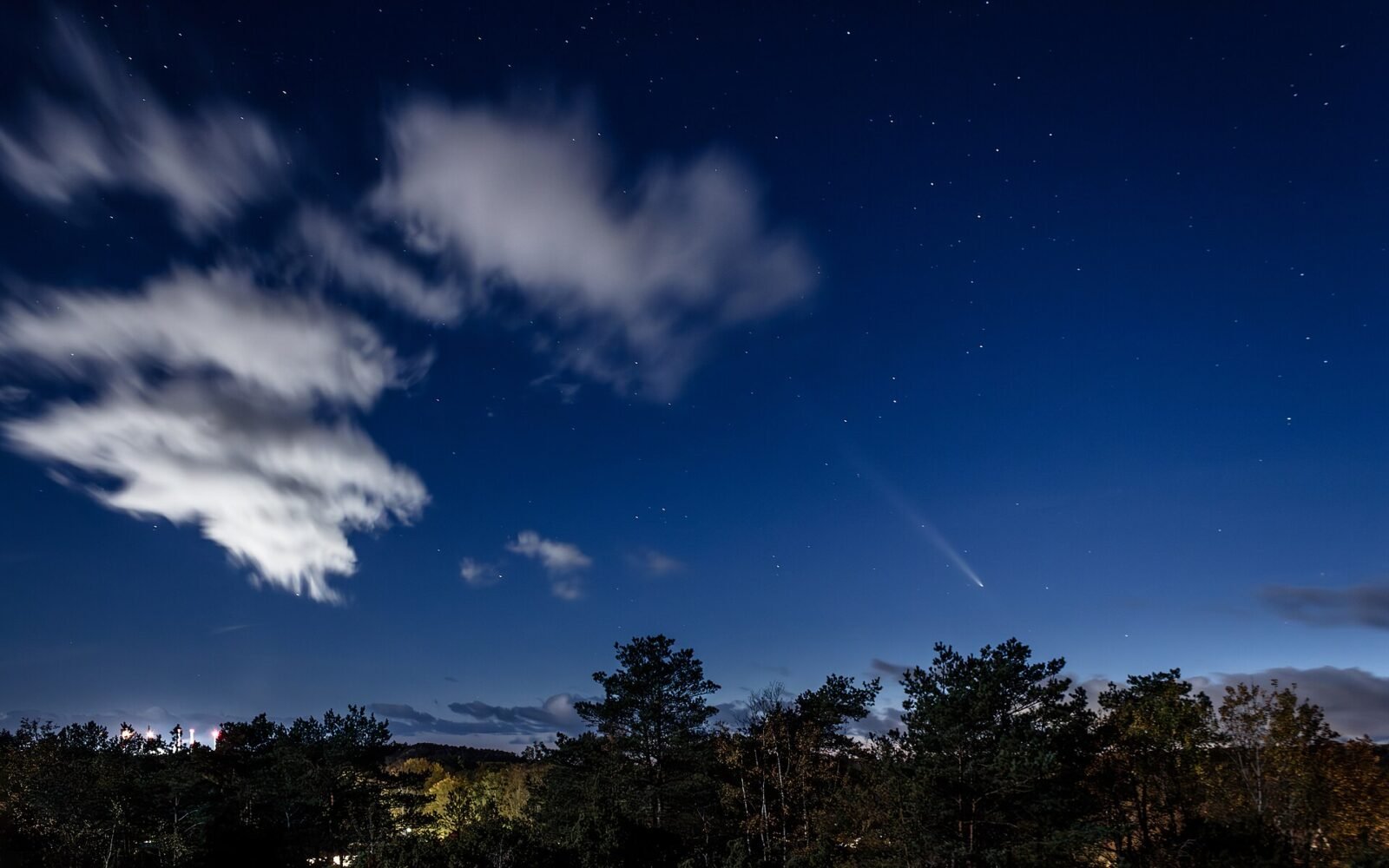 A clear night sky showing the Moon and a bright planet